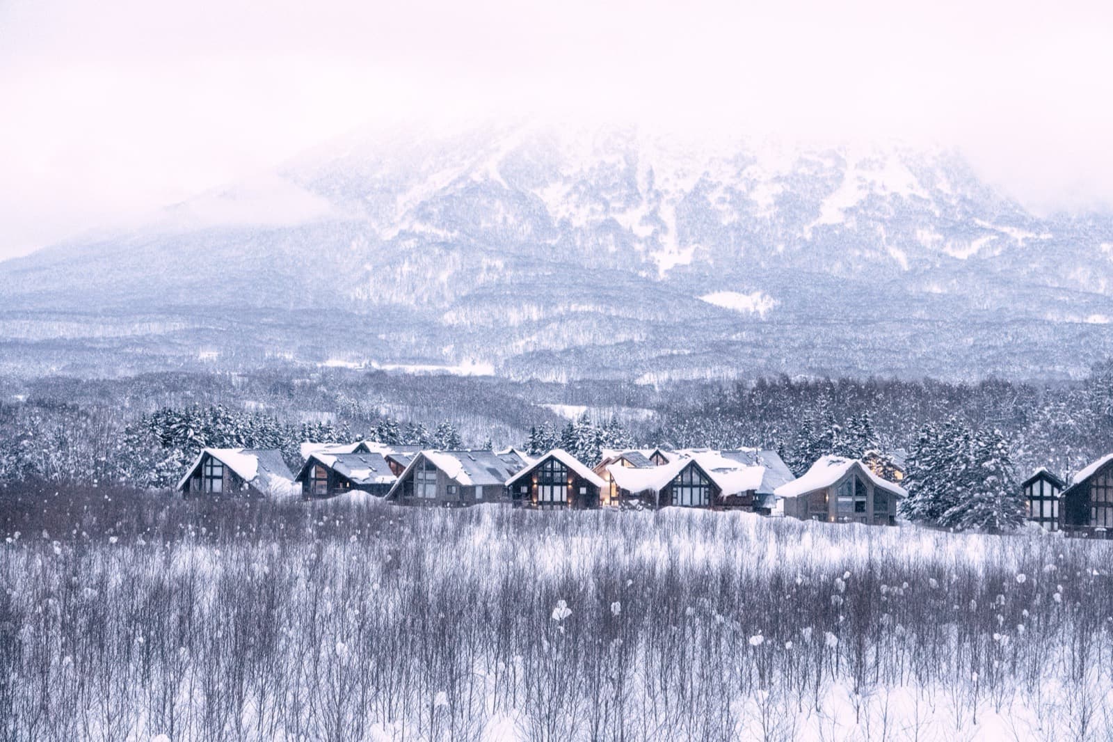 Exterior — dawn, snow-lit, Mount Yotei in the distance